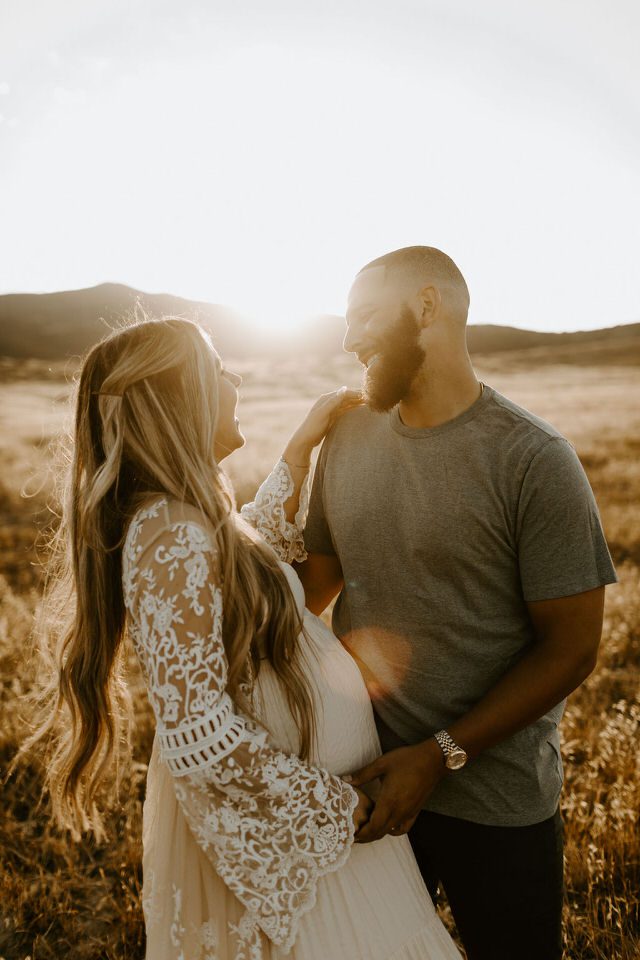 Maternity photos at sunset in a field